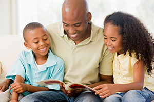 Dad reading to kids