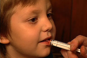 Child taking medicine