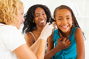 Nurse examining child 