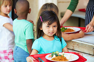 Girl holding lunch tray