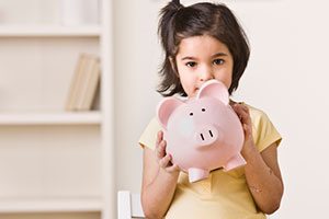 Girl with piggy bank