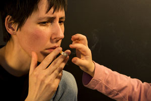 Toddler reaching for cigarette