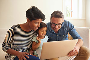 Family looking at computer