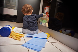 Toddler getting into cleaning supplies