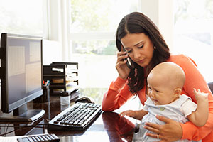 Mom calling doctor with sick baby