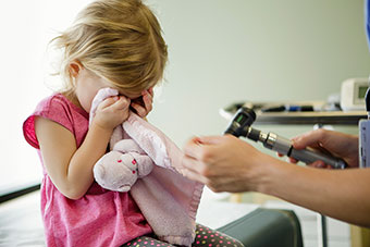 Little girl crying at the doctor's office