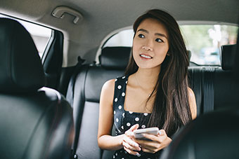teen girl in back seat of car