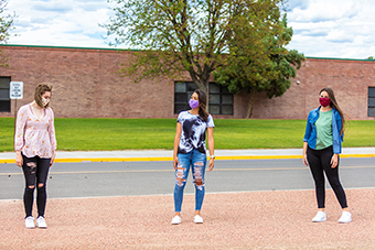 teen girls social distancing outside