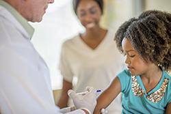 Young girl receiving flu shot