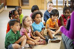 Preschool children listening to their teacher