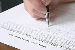 parent filling out organ donation form