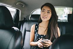 teen in back seat of car
