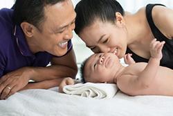 Dad and mom with a newborn baby