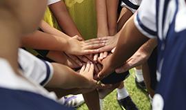School sports team huddle